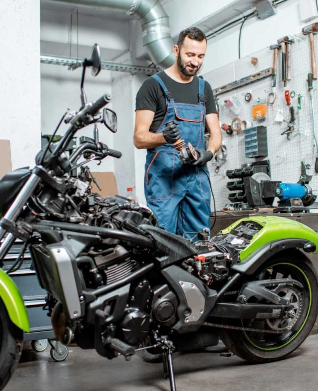 biker-with-motorcycle-in-the-garage-resize.jpg